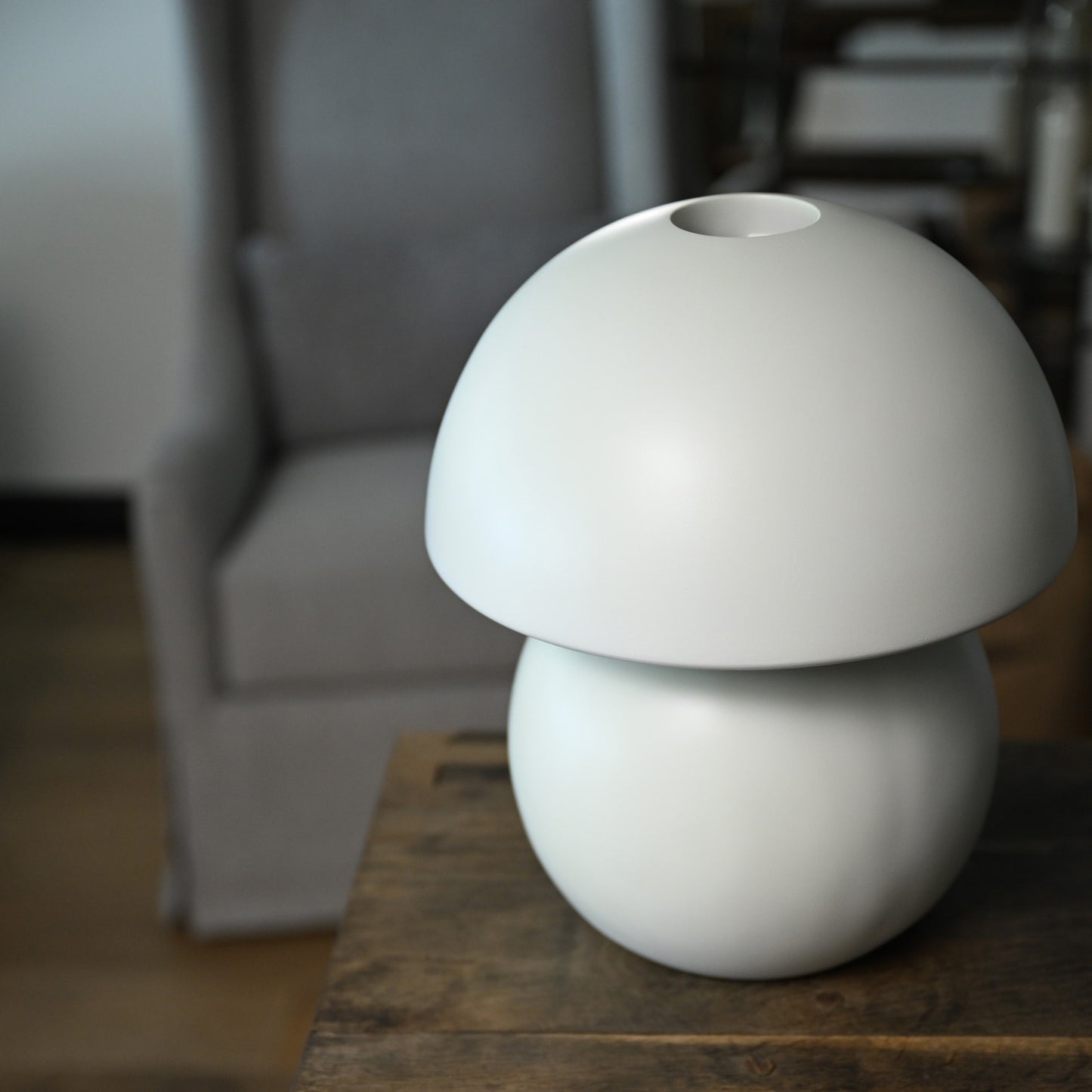 White ceramic mushroom-shaped luna porcelain table lamp with matte finish and rounded dome top floor model