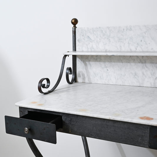 Early 20th century marble vanity with vintage style marble top and ornate black wrought iron scrollwork legs