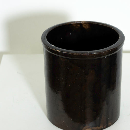Black cylindrical container on a white background