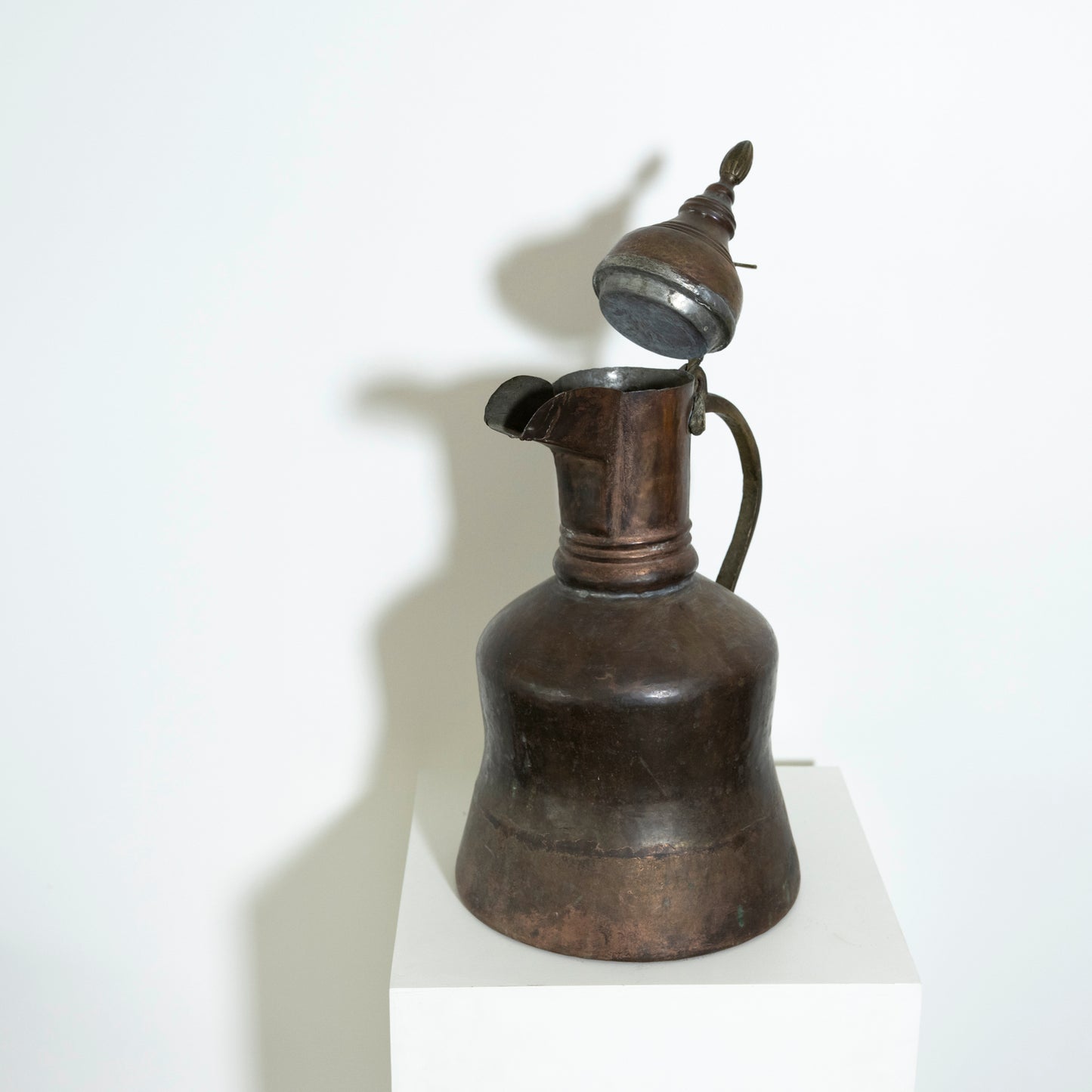 Vintage metal oil lamp on a white background