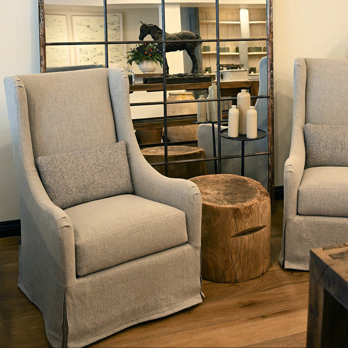 Custom order Elaine swivel wingback chair in beige textured fabric upholstery with matching cushion for comfortable seating