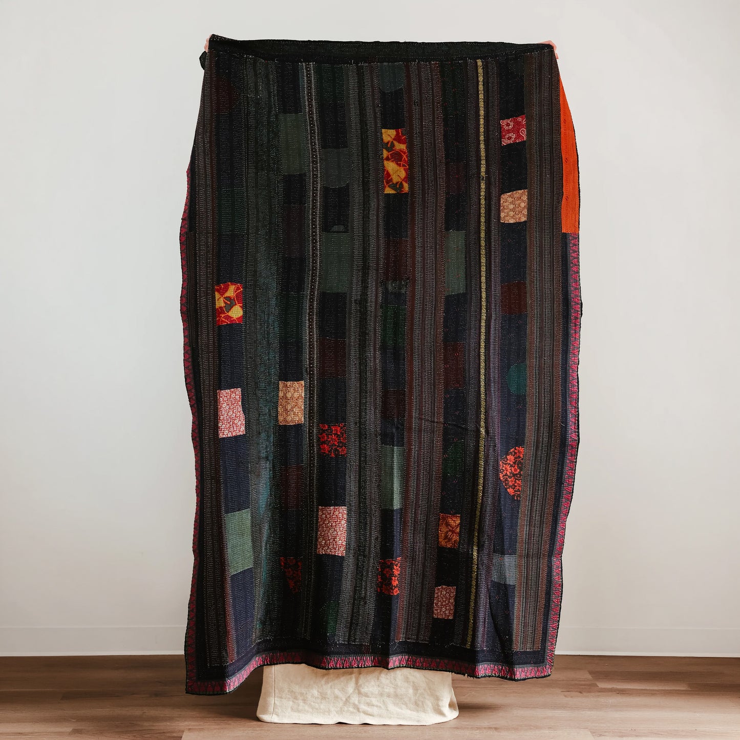 Long, patterned, multicolored quilt