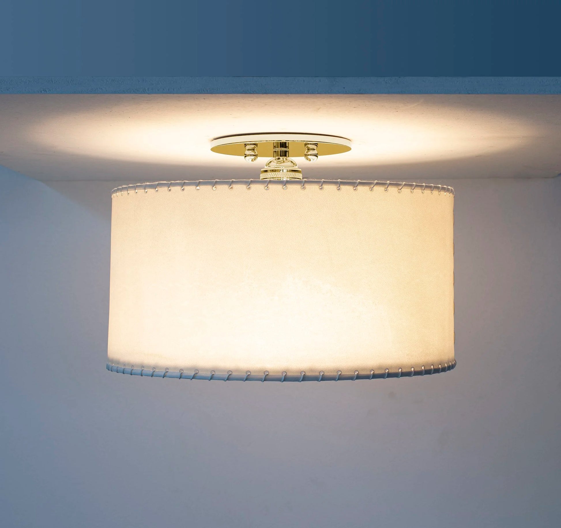 Parchment flushmount warm cylindrical ceiling light with cream fabric shade and gold-toned metal trim