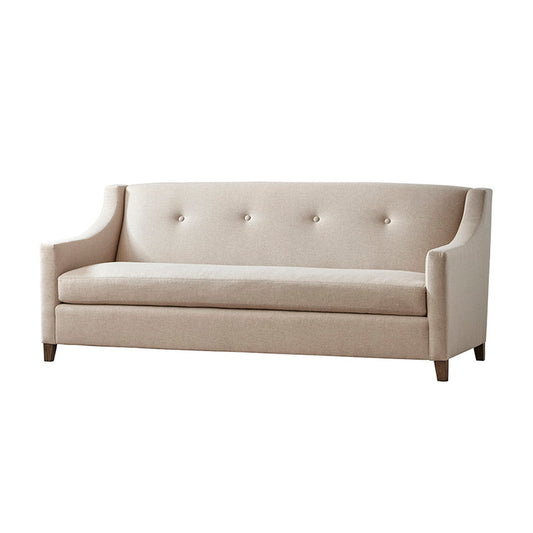 Beige upholstered custom order Palisades sofa with tufted back and wooden legs in a living room setting
