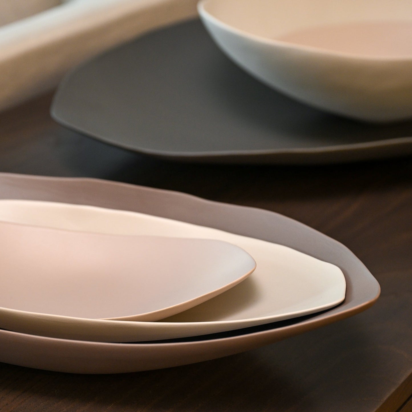 Stacked ceramic plates barchetta strette small in turtledove with soft pastel tones and gently curved edges