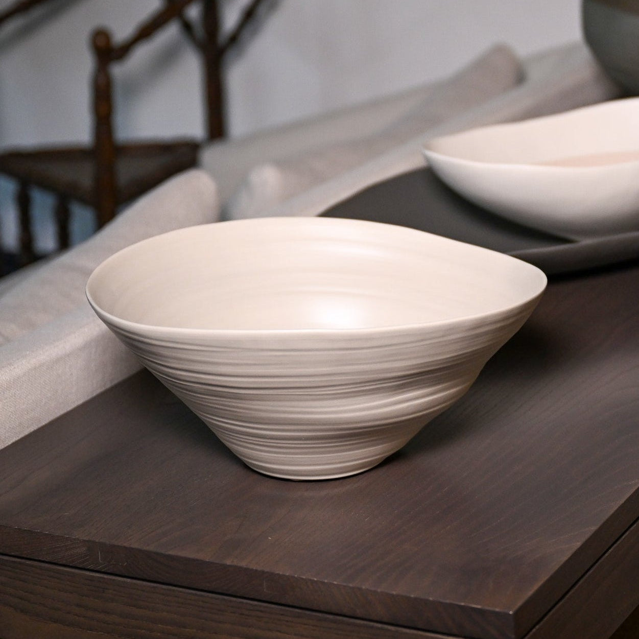 Cream-colored ceramic campanella medium hemp bowl with subtle concentric ridges and smooth glossy finish