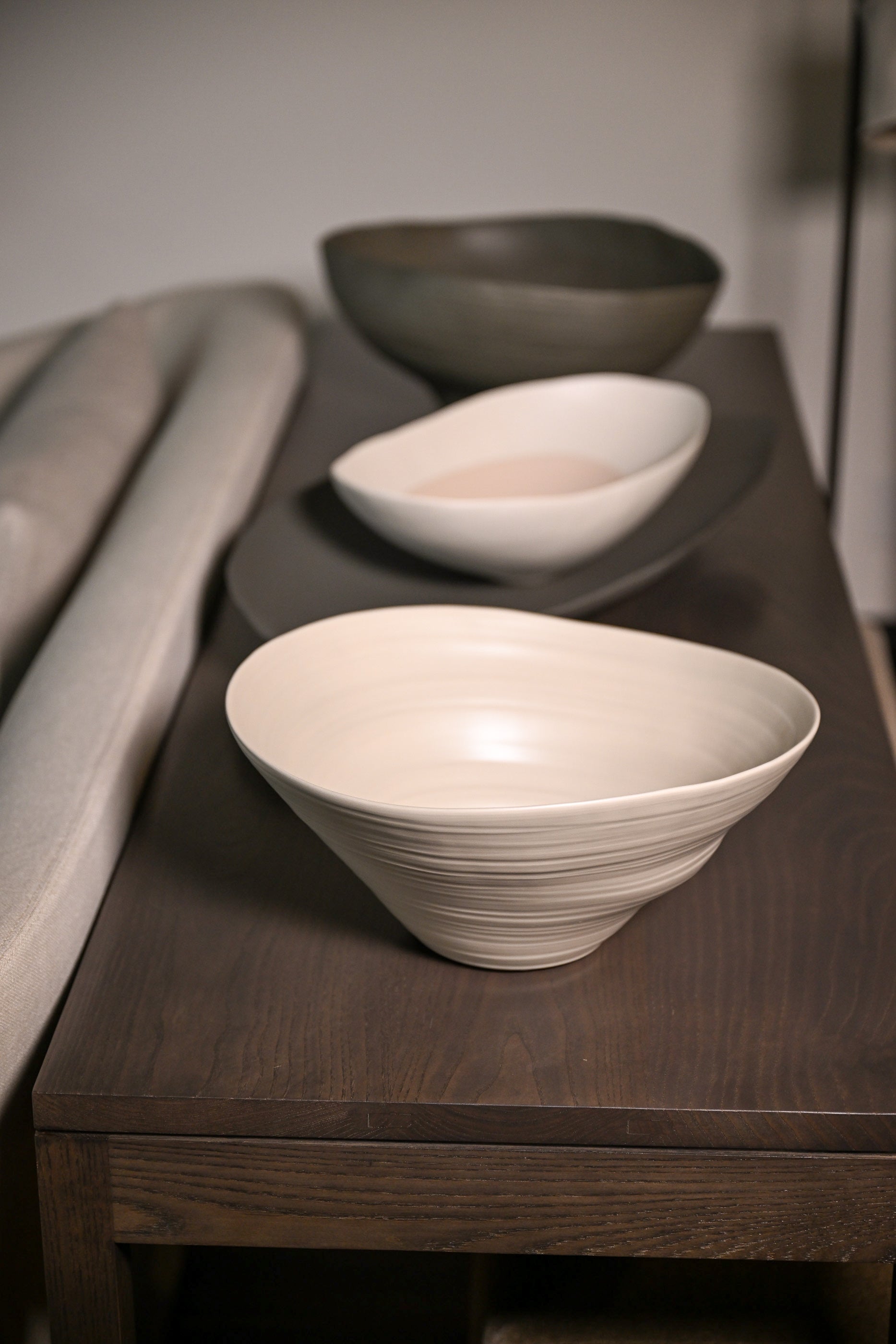 Cream-colored ceramic campanella medium hemp bowl with subtle concentric ridges and a smooth glossy finish