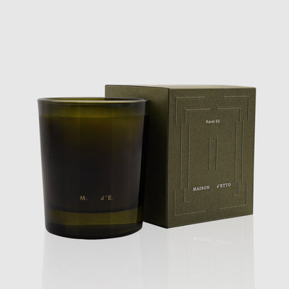 Olive-green glass candle jar with minimalist etched branding for maison detto candle karat eg