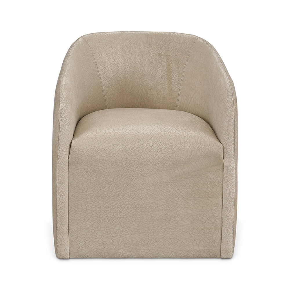 Beige faux leather Jolene slipcovered swivel bucket chair with soft textured surface and modern clean lines floor model