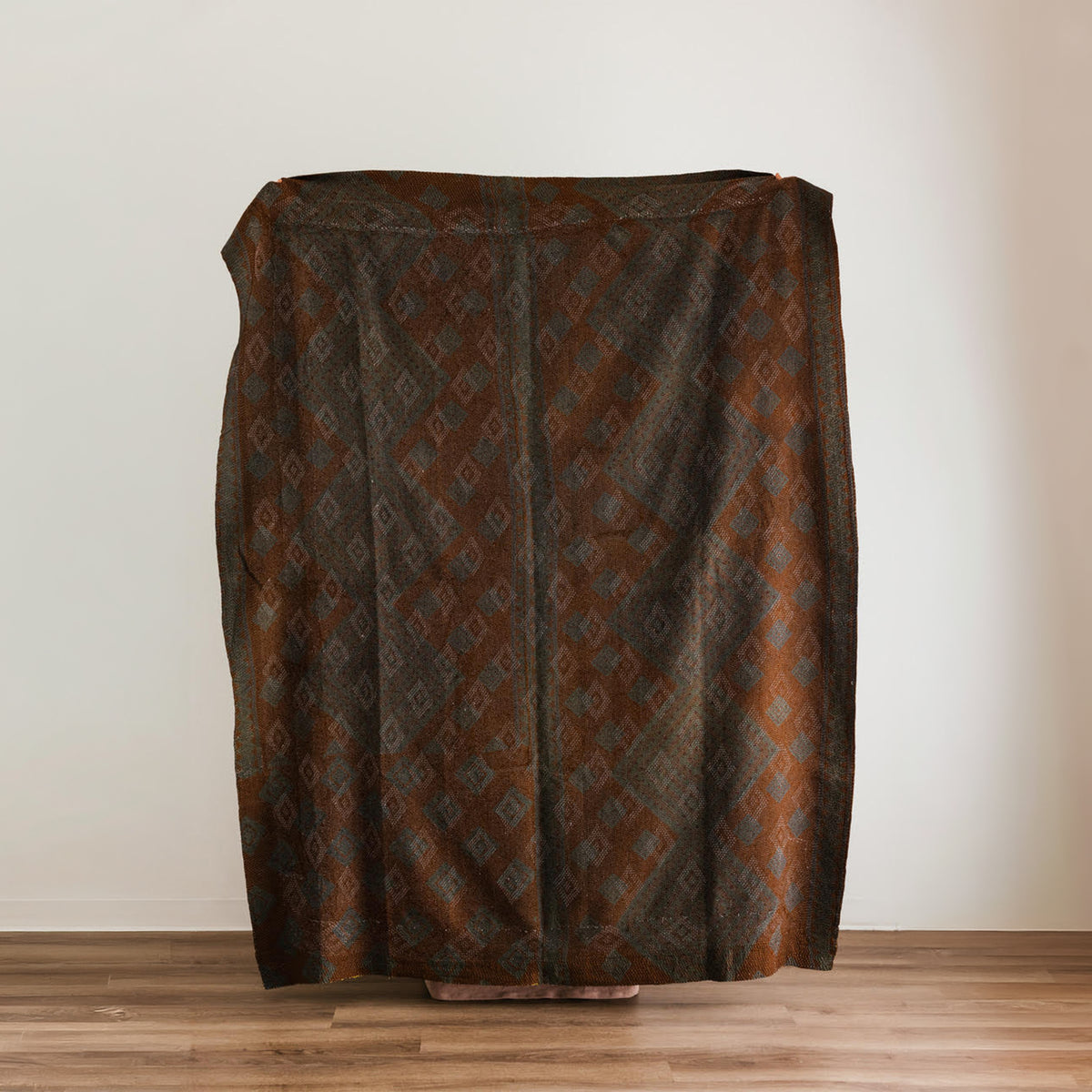 A diamond-patterned large throw blanket.
