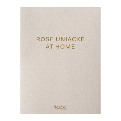 Beige book cover with 'Rose Uniacke At Home' and 'Rizzoli' in gold text
