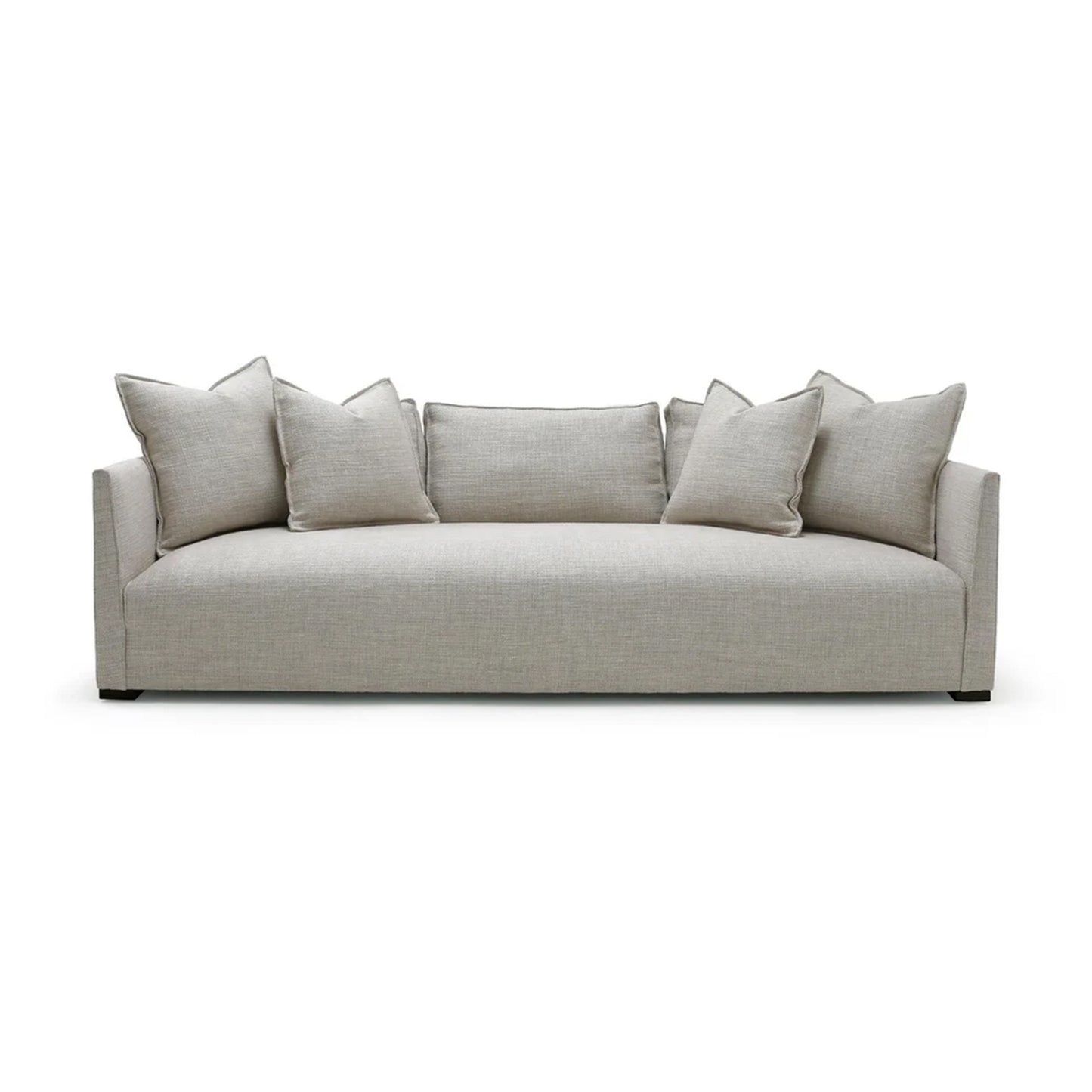 Beige sofa with cushions on a white background