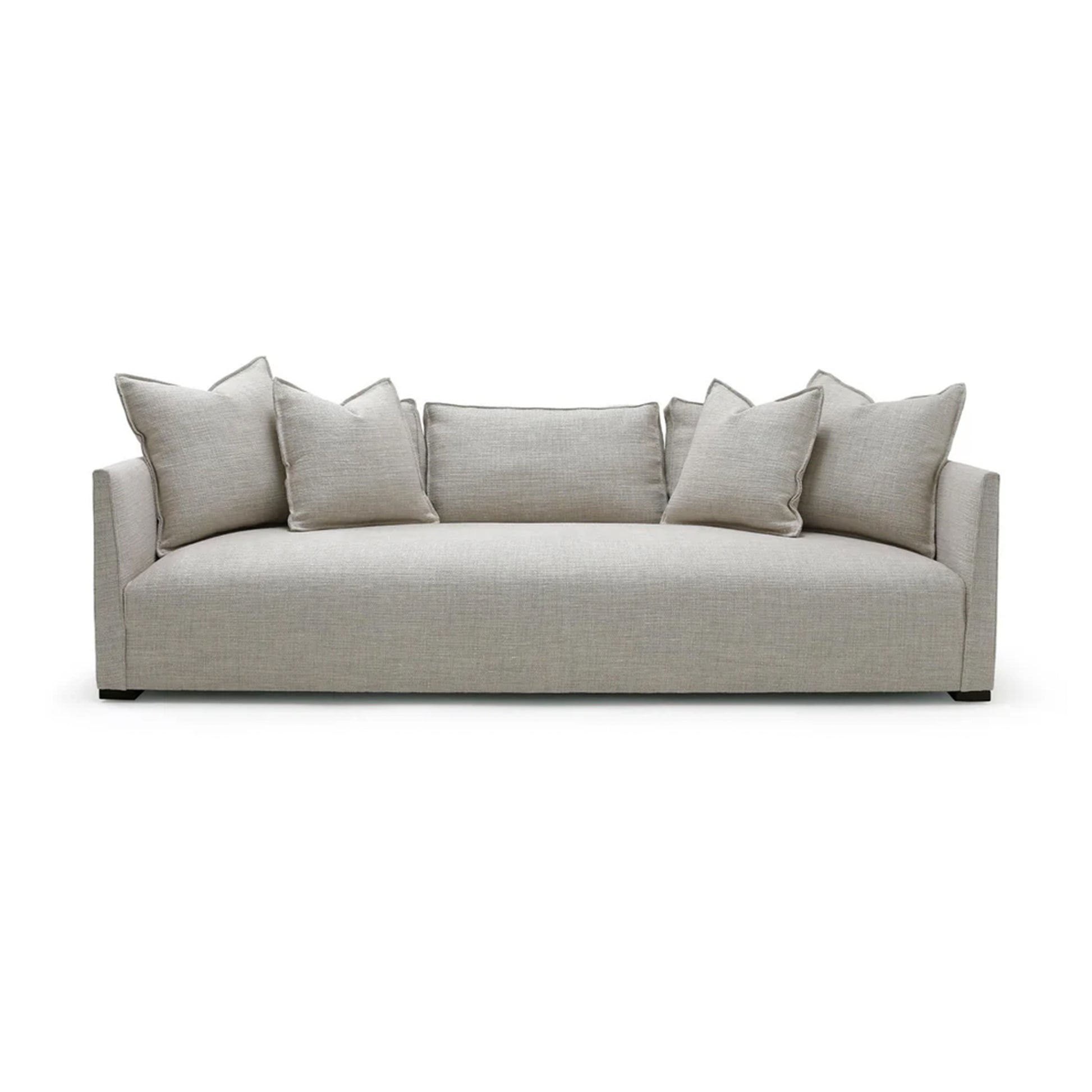 Beige sofa with cushions on a white background