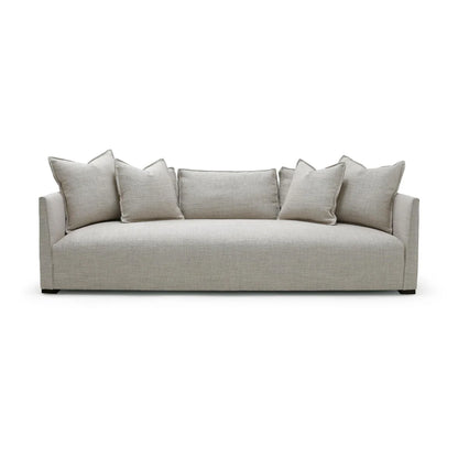Beige sofa with cushions on a white background