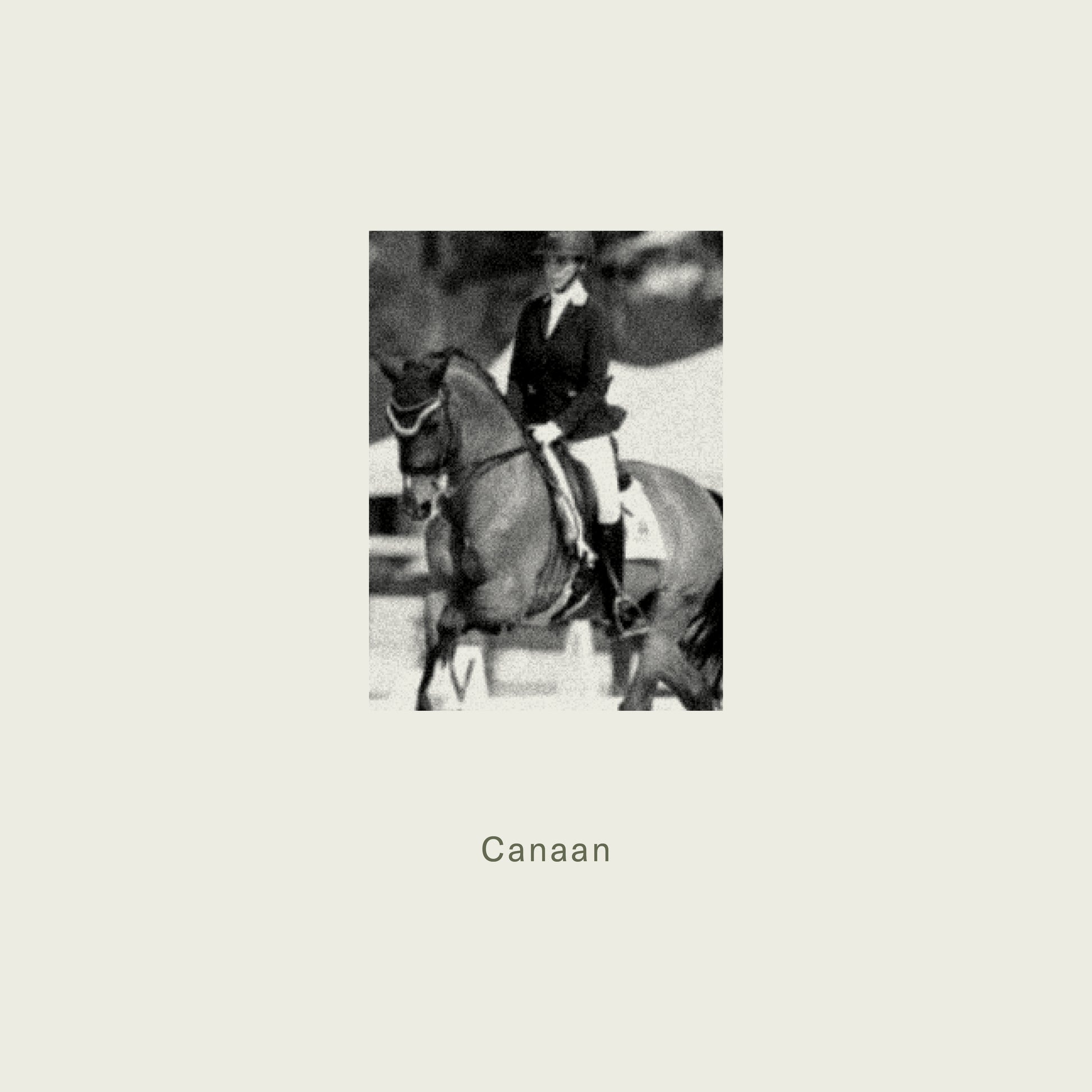 Black-and-white photograph of a rider in formal equestrian attire on a dark horse for maison dette fragrance canaan