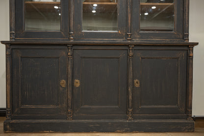 Late 19th century french display cabinet in dark gray distressed wood with glass upper section and brass oval handles