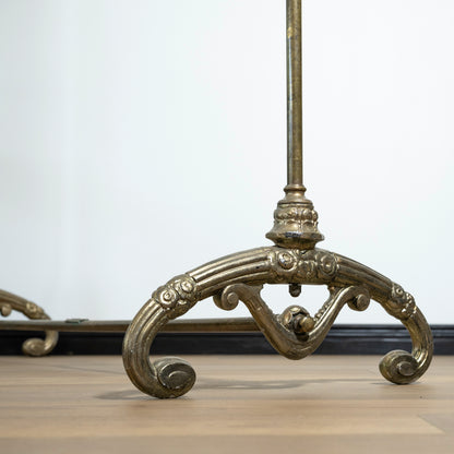 Decorative metal rack with intricate designs on a light background