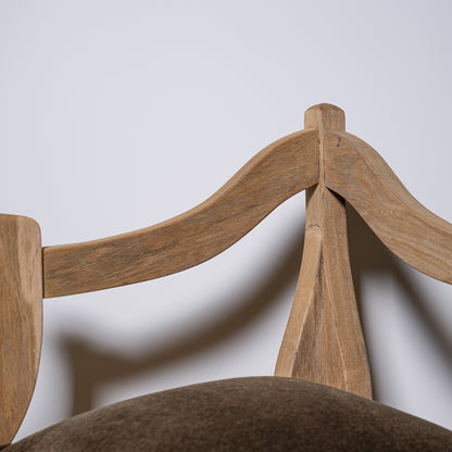 Light brown carved wood corner stool backrest with curved arms and central support post shown from the back side
