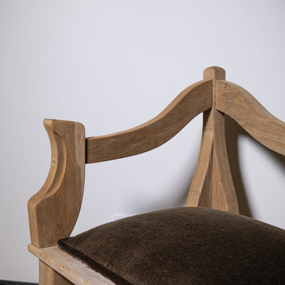 Light-colored wooden carved wood corner stool with curved backrest and dark brown mohair upholstered seat