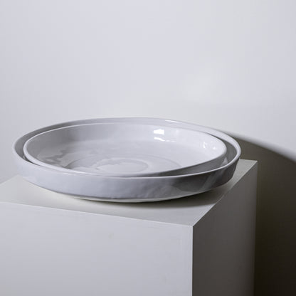 Two nested white ceramic plates with gray marbling and glossy finish in the cottonwood platter no 316 design