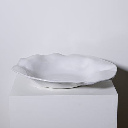 A white ceramic Cyprus platter no 724 with a smooth glossy finish and an organic wavy rim