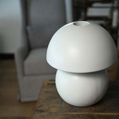 White ceramic mushroom-shaped luna porcelain table lamp with matte finish and rounded dome top floor model