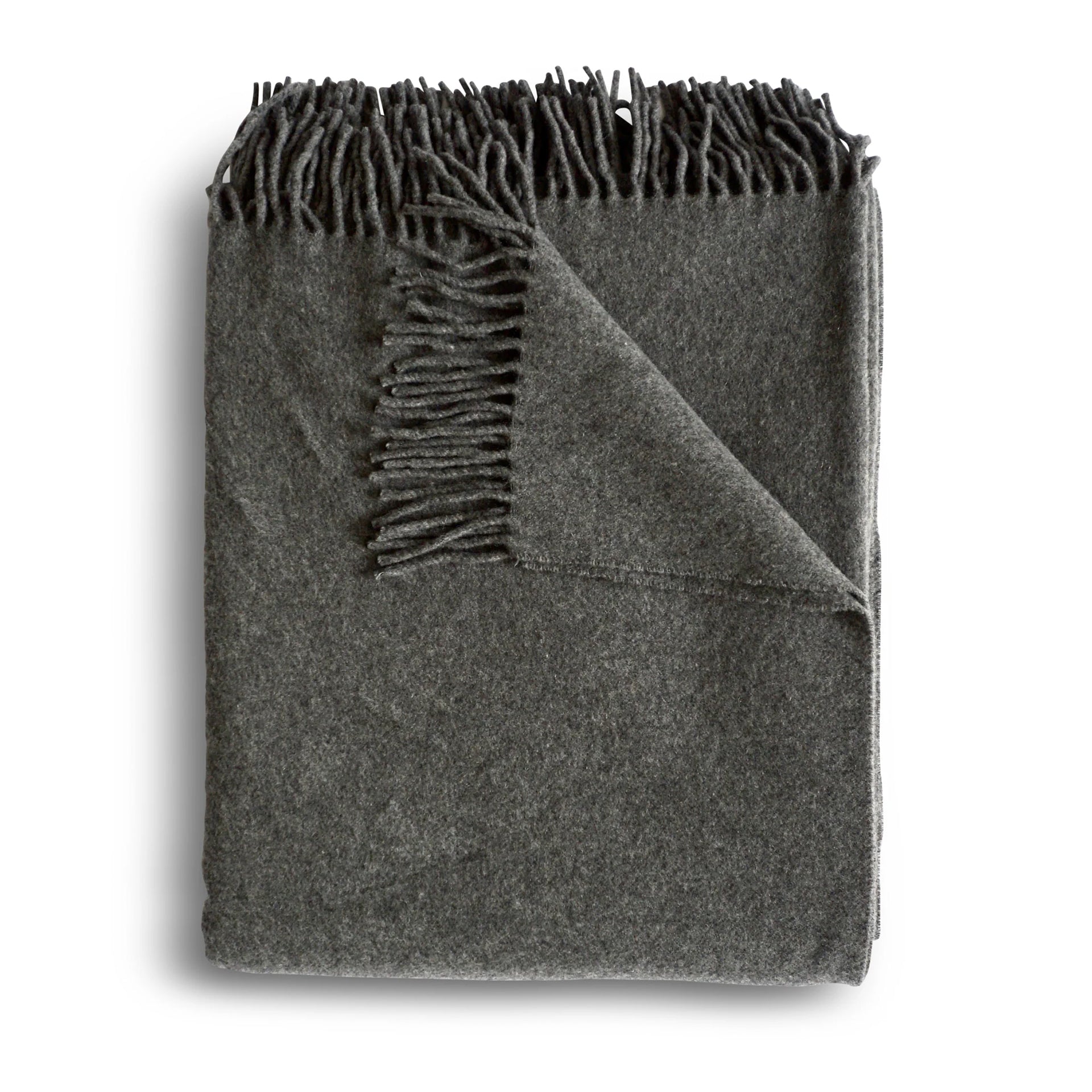 A soft dark gray cashmere throw blanket with textured surface and fringed edges in granite color