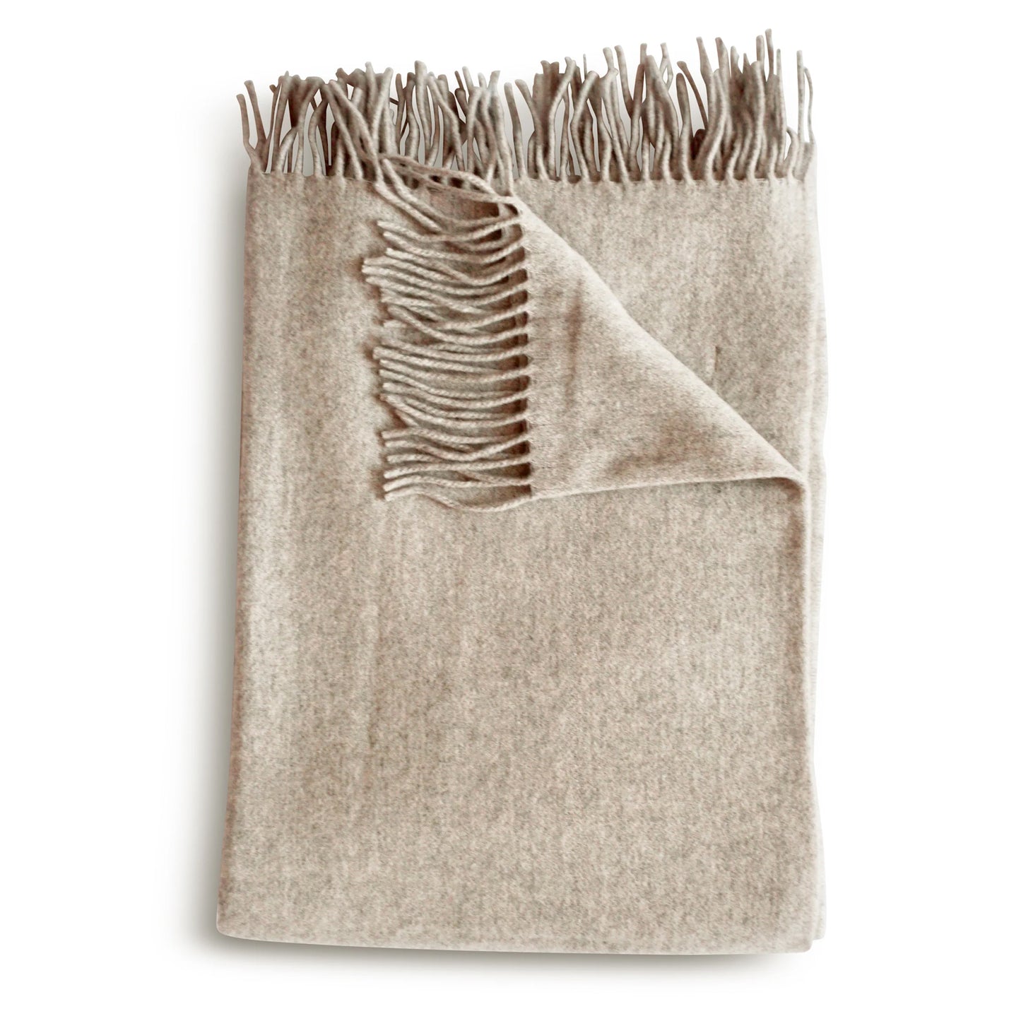 Beige cashmere throw blanket in muslin with soft textured woolen weave and matching fringed edges
