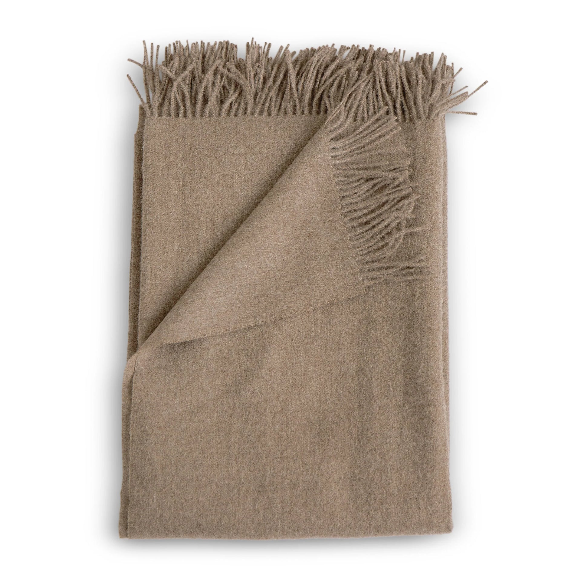 Beige alpaca throw blanket with soft textured weave and fringed edges in fawn color for cozy warmth