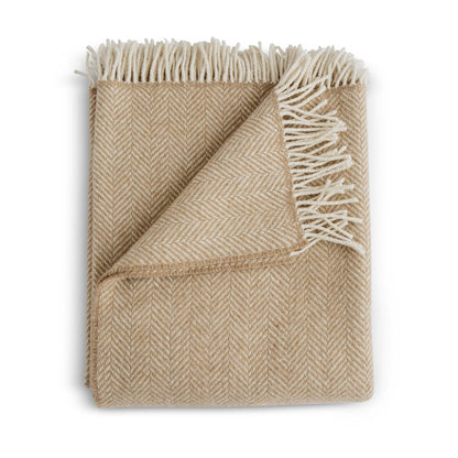 Beige wool herringbone throw blanket with cream-colored fringe perfect for cozy home decor in harvest color