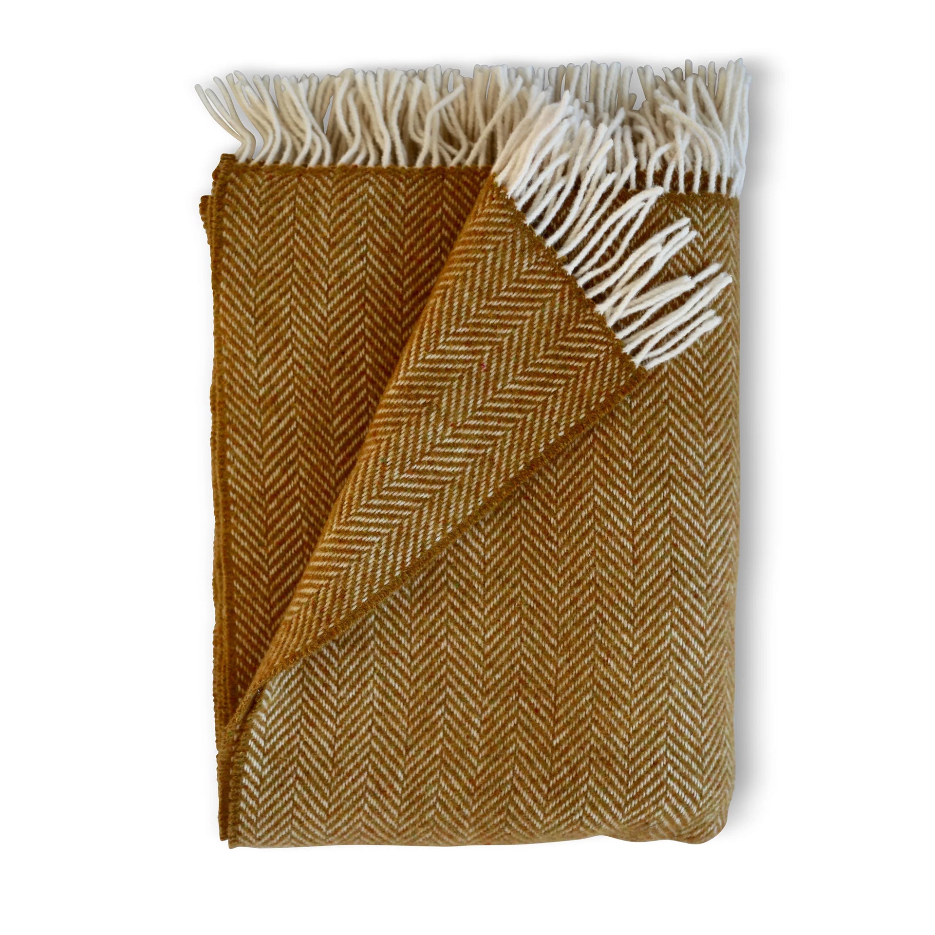 Wool herringbone throw in raw honey features a warm mustard yellow wool with a contrasting cream fringe