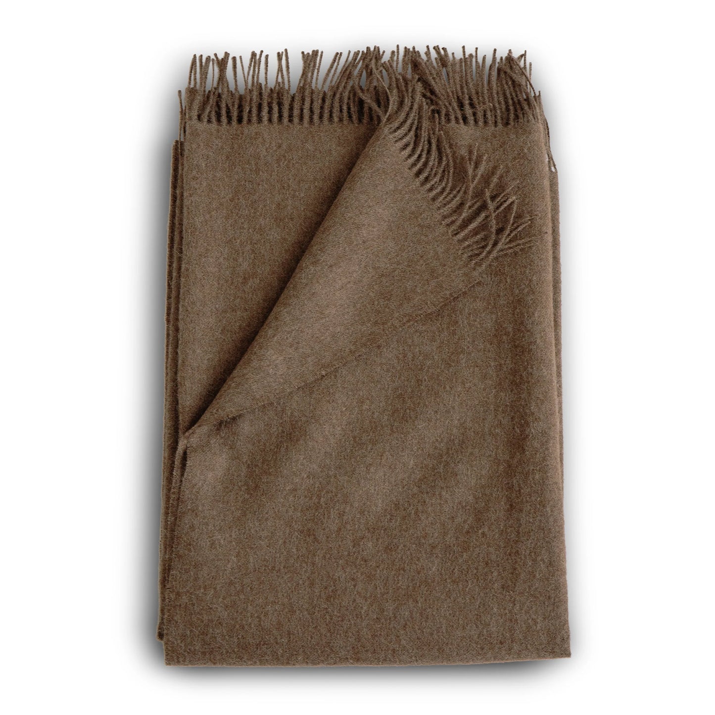 A soft earthy brown alpaca throw in mocha with a textured wool weave and fringed edges