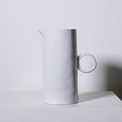 Minimalist white ceramic fir pitcher no 923 with sleek cylindrical body and circular handle for stylish serving
