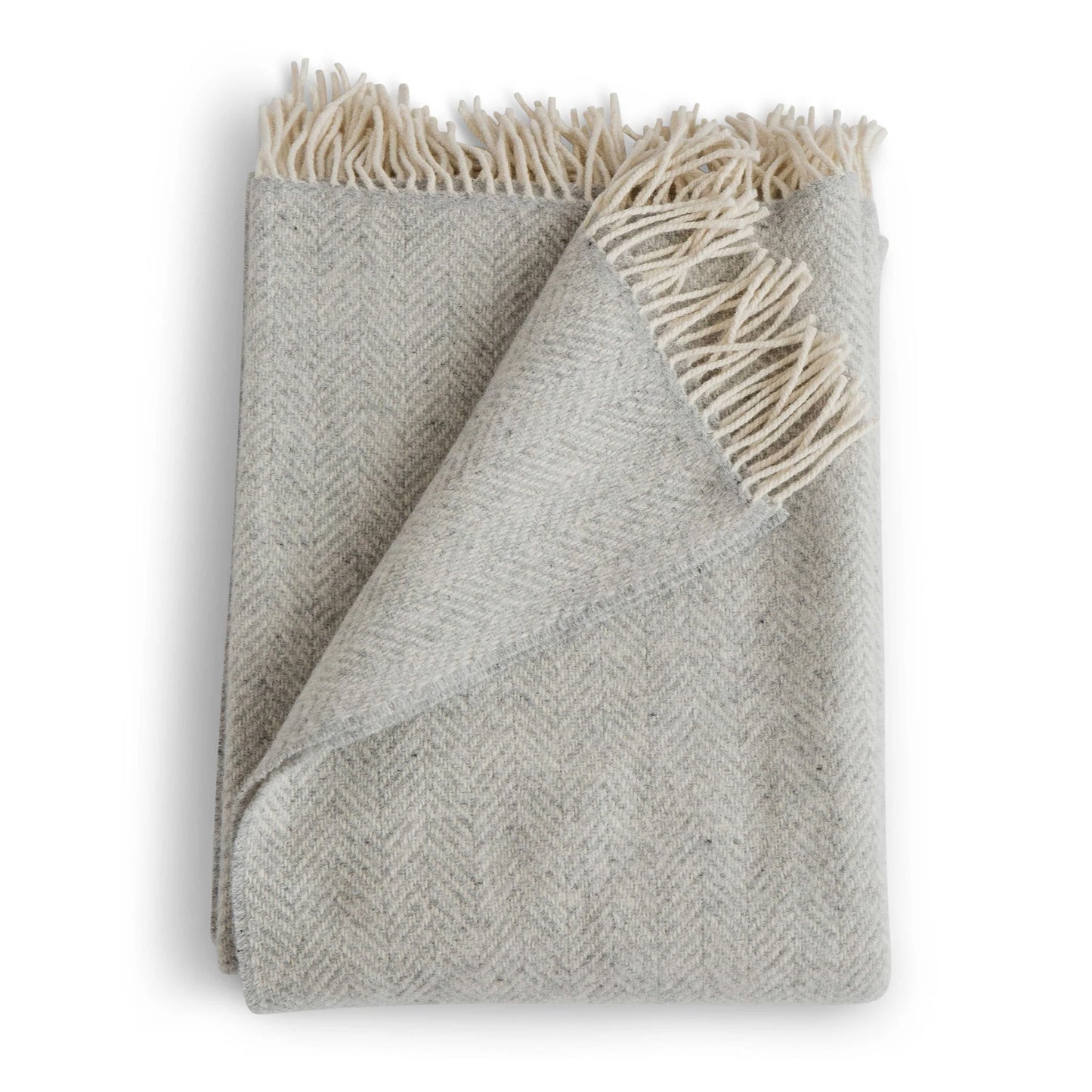Gray woven blanket with white fringe on a white background