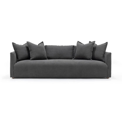 Gray sofa with decorative pillows on a white background