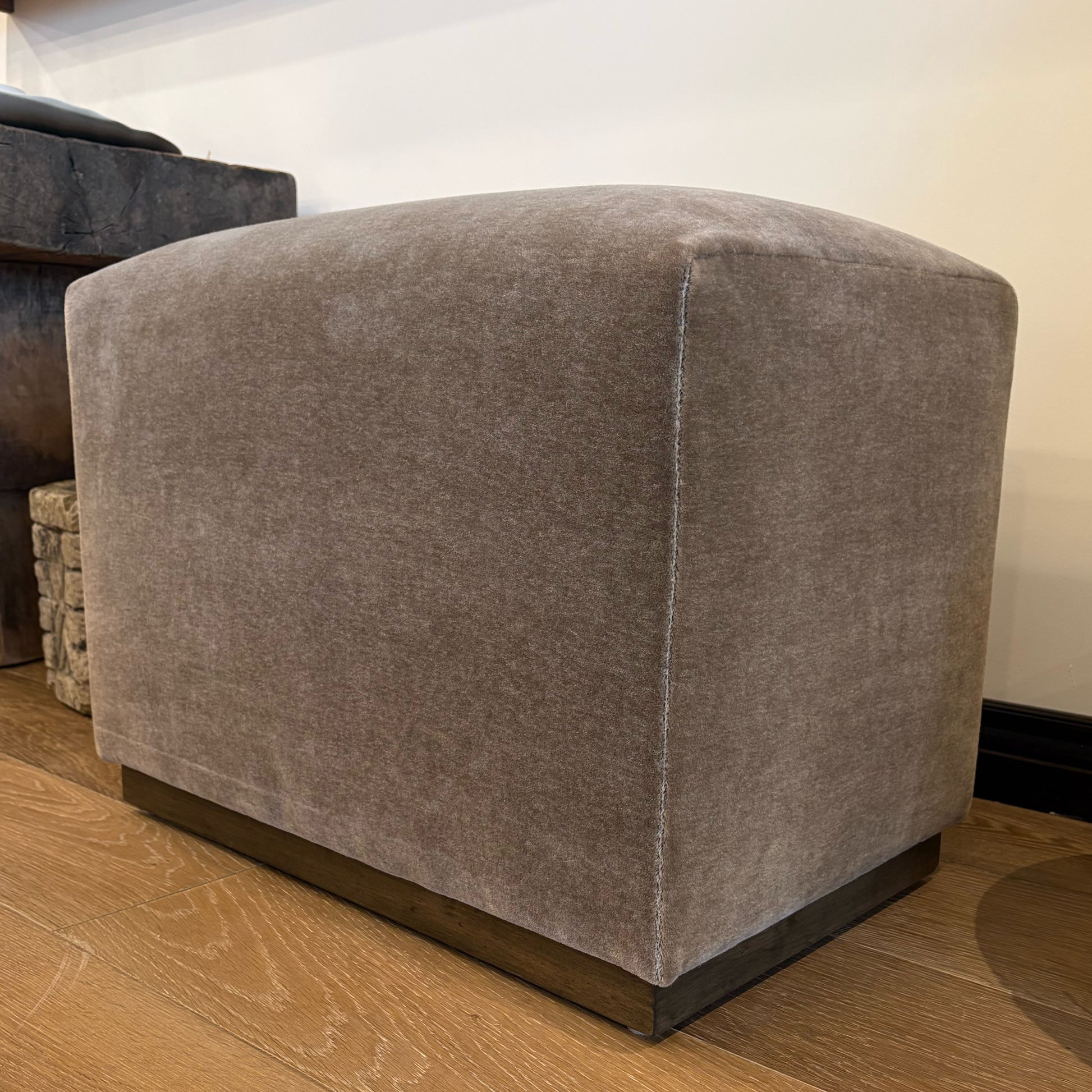 Aurora ottoman with wood base taupe velvet cube ottoman with dark wood base floor model