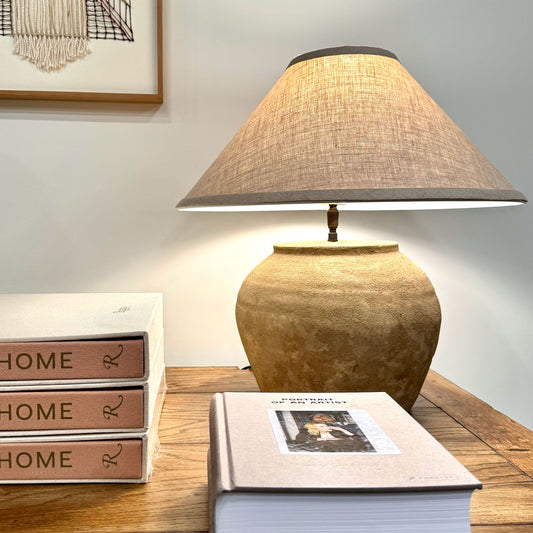 Mid century shanxi clay pot table lamp with earthy tones textured woven linen shade and dark metal trim