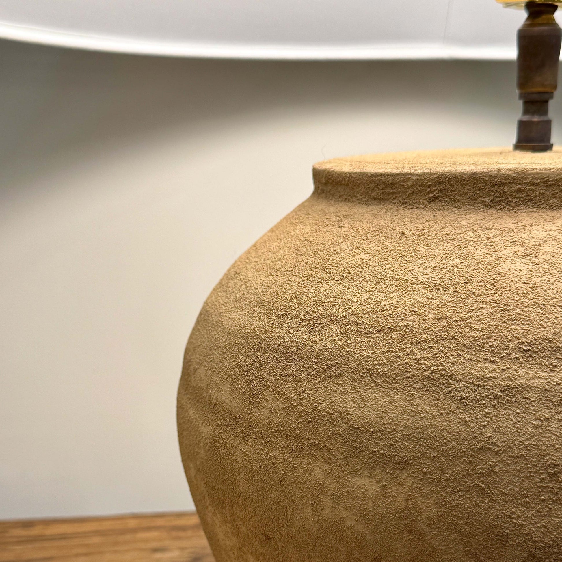 Tan textured ceramic lamp base with rustic earthy finish in mid century shanxi clay pot table lamp