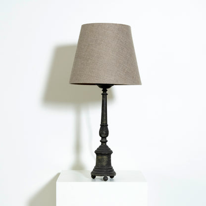 Table lamp with a gray shade.