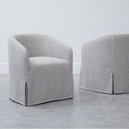 Custom order jolene swivel club chair in gray textured fabric with rounded back and skirted base for comfortable seating