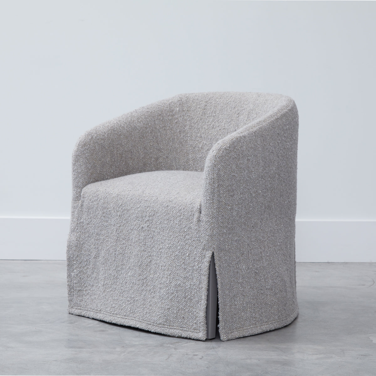 A cozy light gray custom order Jolene swivel club chair with soft textured fabric and modern design