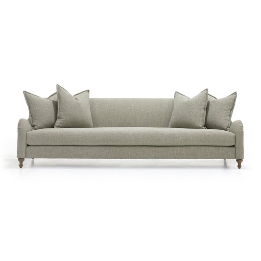 Custom order Margot sofa in sleek sage green upholstery with tufted detailing and wooden legs for stylish comfort