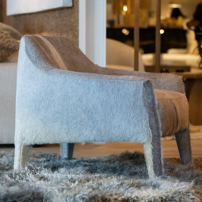 Custom order Murphy chair cozy armchair upholstered in soft light gray and tan cowhide with a plush textured finish
