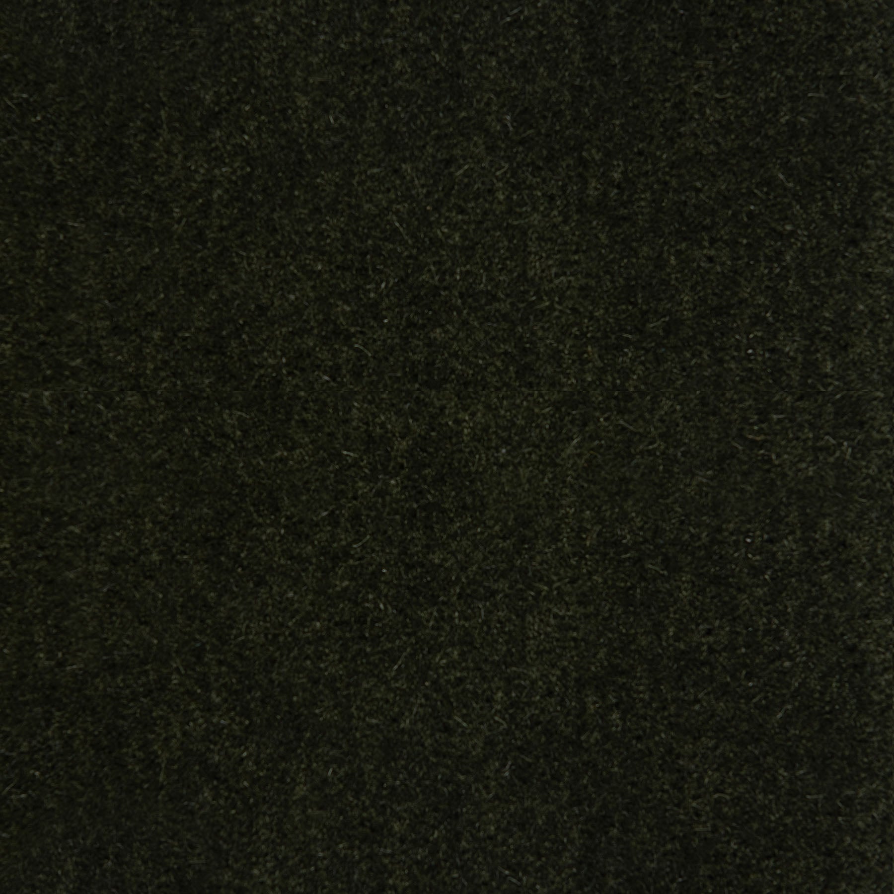 Dark green textured fabric with a dense, fibrous surface.