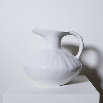 White ceramic oak pitcher no 431 with a glossy finish and subtle vertical ridges ideal for serving beverages