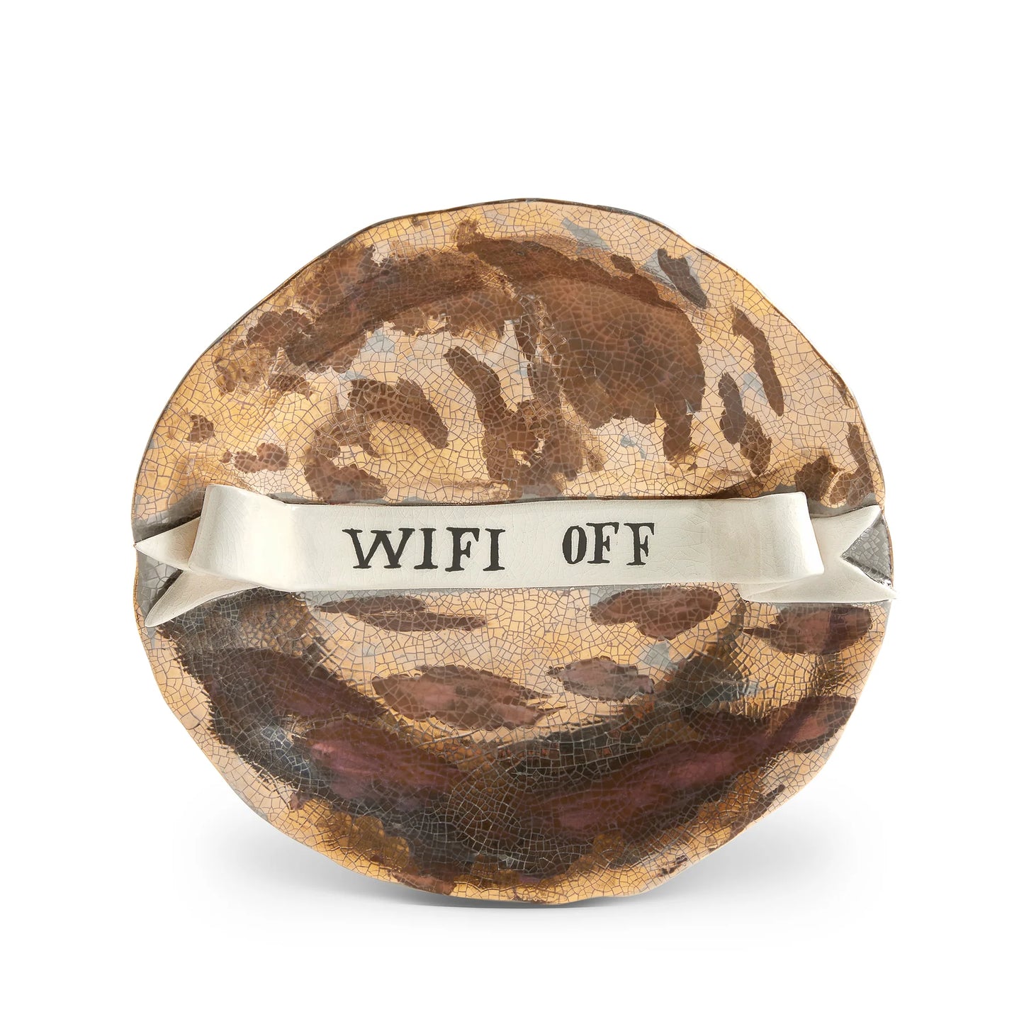 A round crackled ceramic ruan hoffman wifi off plate with brown gold glaze and a white ribbon band across center