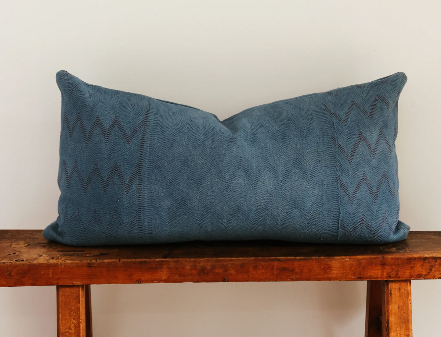 Blue rectangular Elleri lumbar pillow with subtle woven zigzag pattern ideal for back support and decor