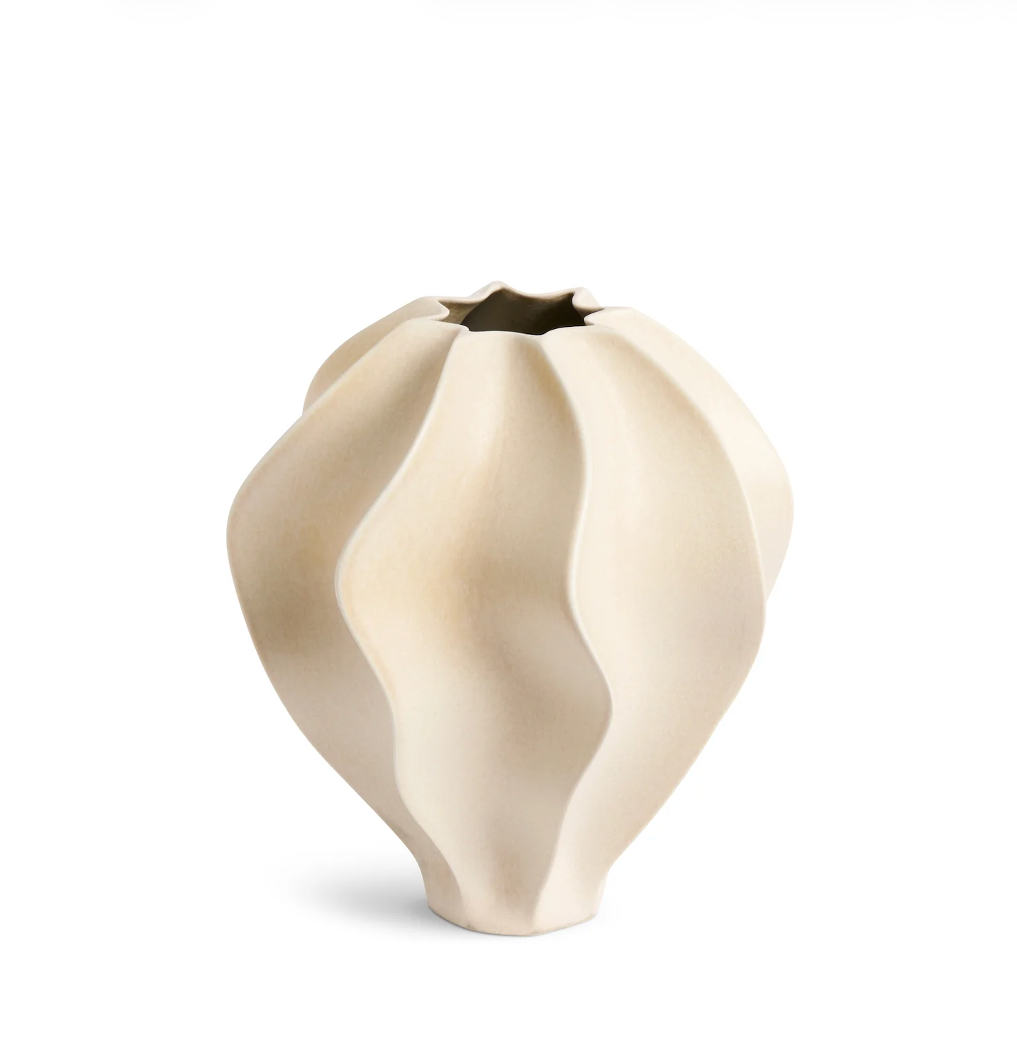 White ceramic vase with a wavy design on a white background