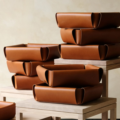 Brown leather assembly basket with sleek minimalist design for organized storage and assembly tasks