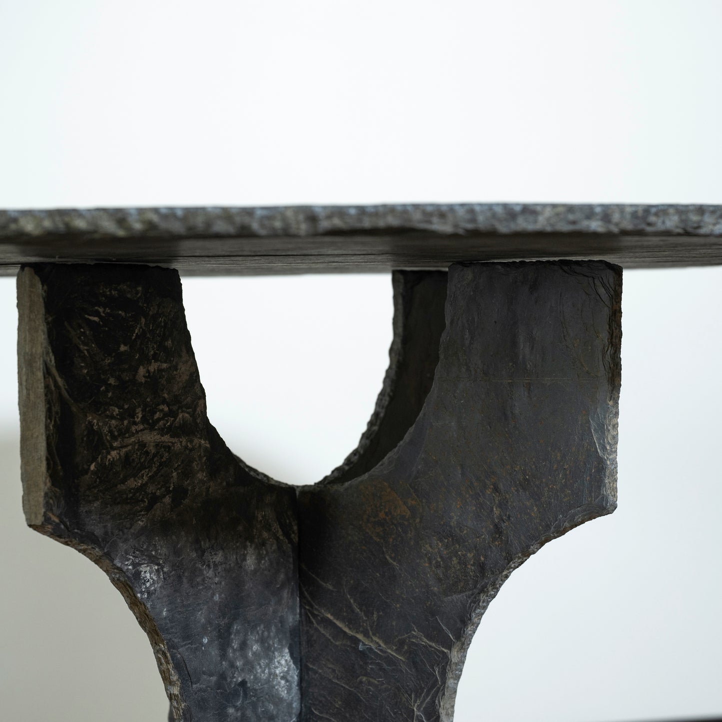 Close-up of a stone table with a white background